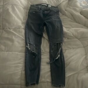 Mid rise ripped blue jeans